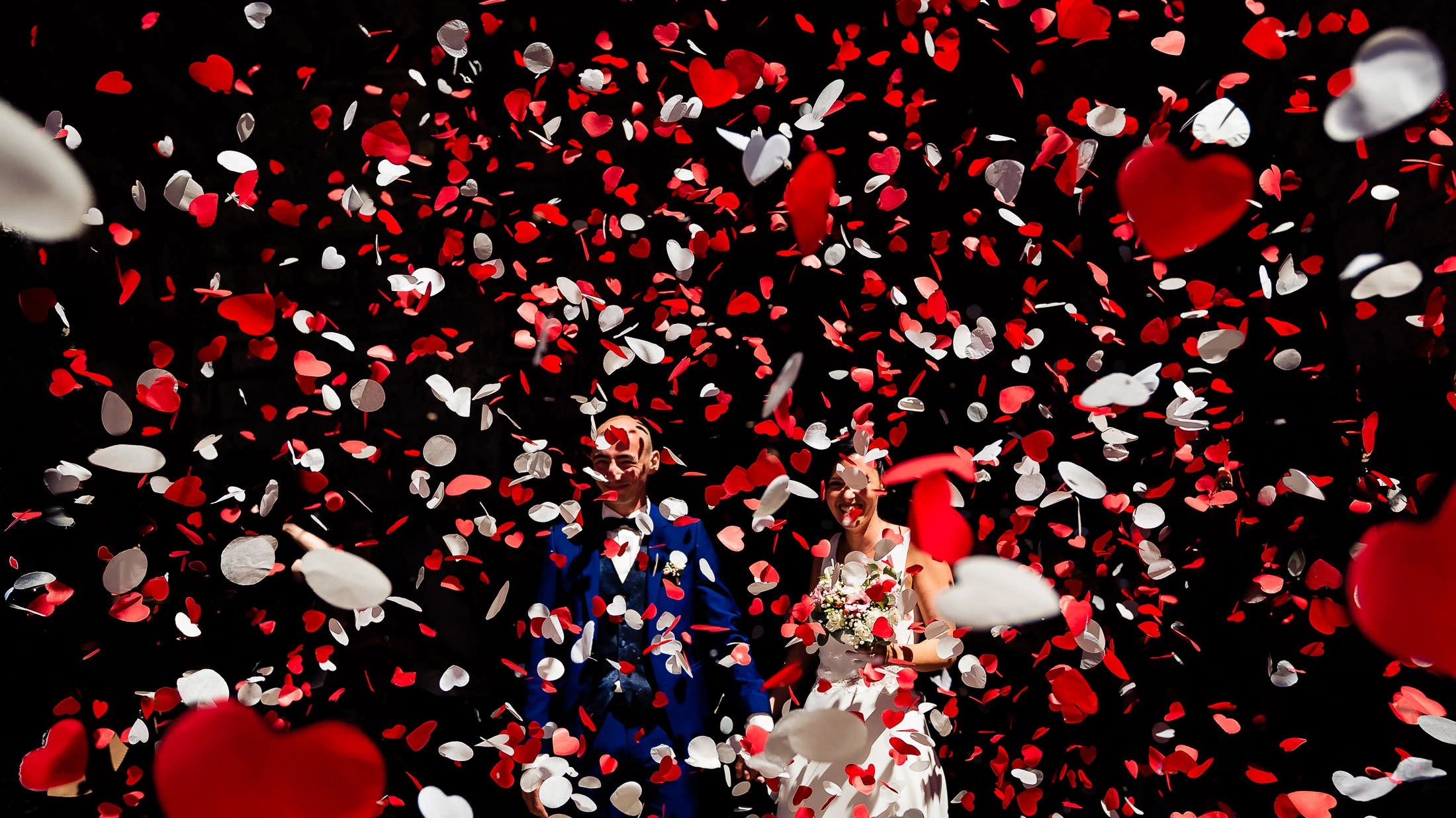 Wedding photographer in Montpellier, France — confetti toss and laughter