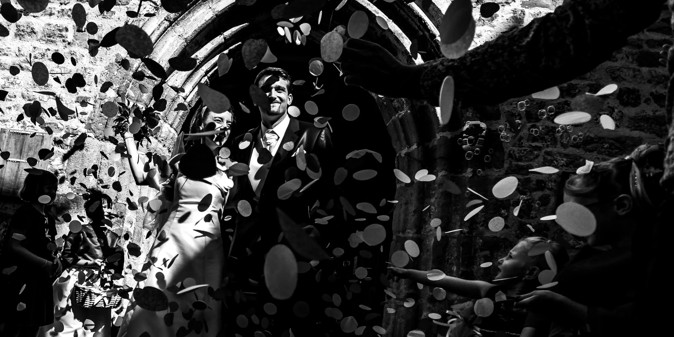 Wedding photographer in the South of France — black and white church exit